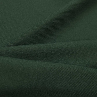 Ткань костюмная 21010 2076, 225 гр/м2, шир.150см, цвет т.зеленый - купить в Перми. Цена 394.71 руб.